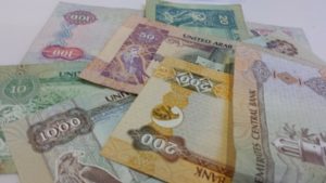 A picture of different currency notes used in dubai